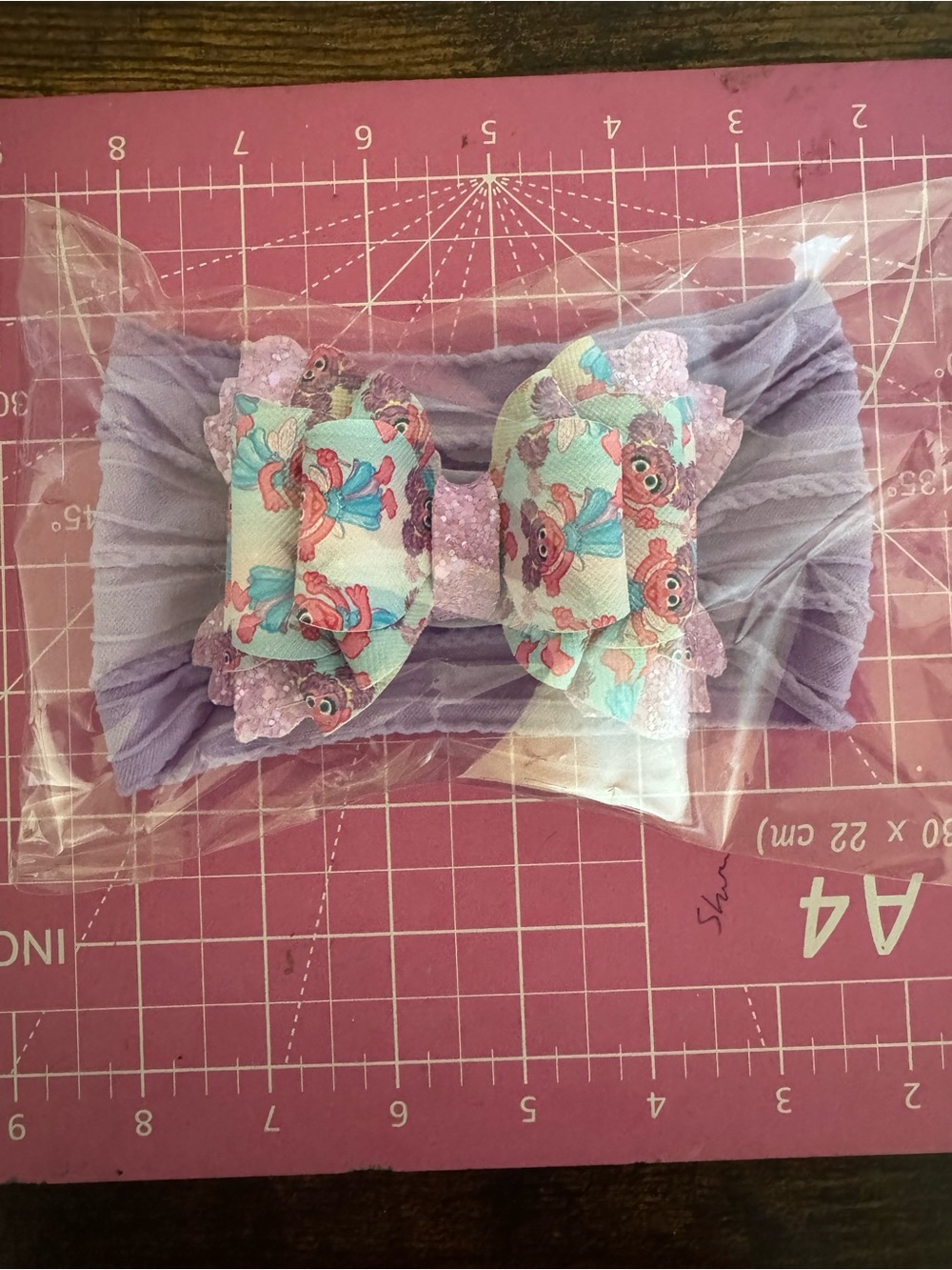 Lilac Stretch Headband with Decorative Trolls Bow